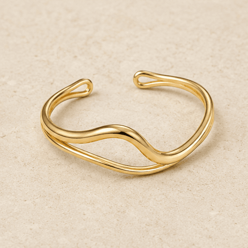 Gold sculptural wave cuff
